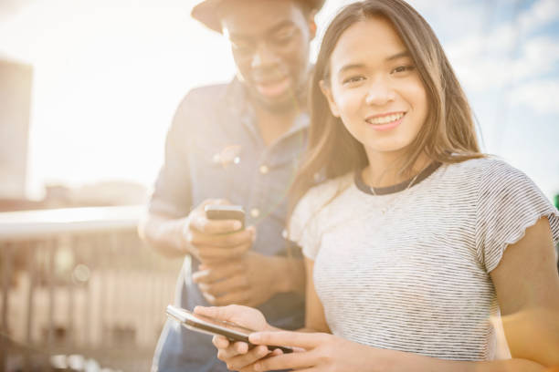 istock Checking messages millenial couple with mobile phone 909402866