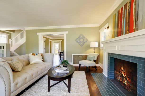 istock Chic green living room with a traditional fireplace. 909406930