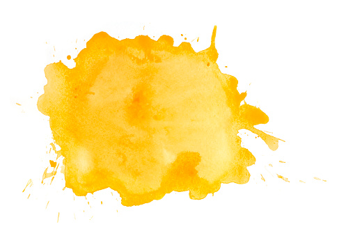 Yellow watercolor spot with splashes on white watercolor paper. My own work.