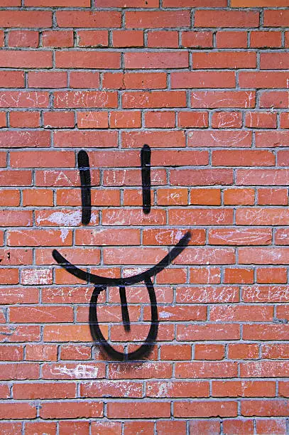 Photo of Brick Wall and Smile Graffiti