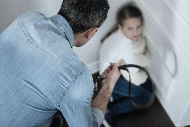 Terrified girl sitting in the corner