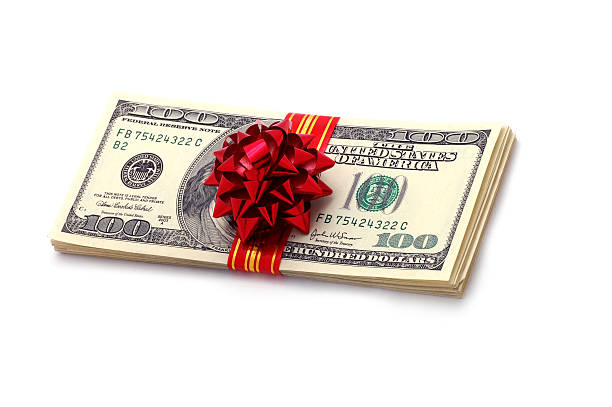 istock Stack of money with red bow wrapped around it 90940900