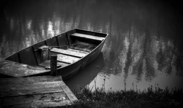 istock A small boat on a lake 909410696