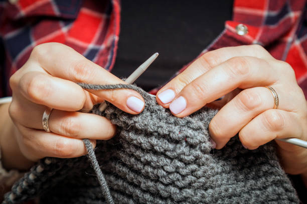 istock beautiful woman knits 909414434