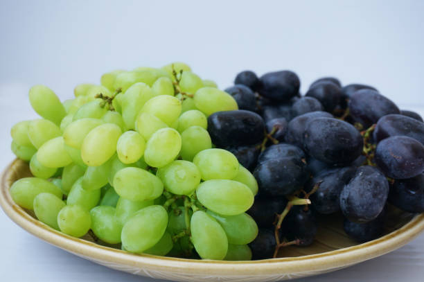 istock Closeup of Fresh grape on plate 909414872