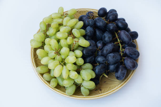 istock Closeup of Fresh grape on plate 909415262