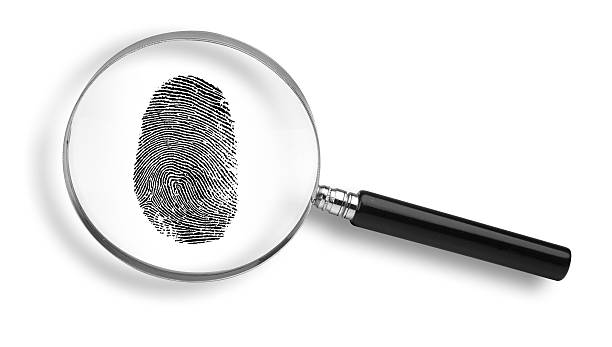 istock Black fingerprint under a magnifying glass on white 90941542