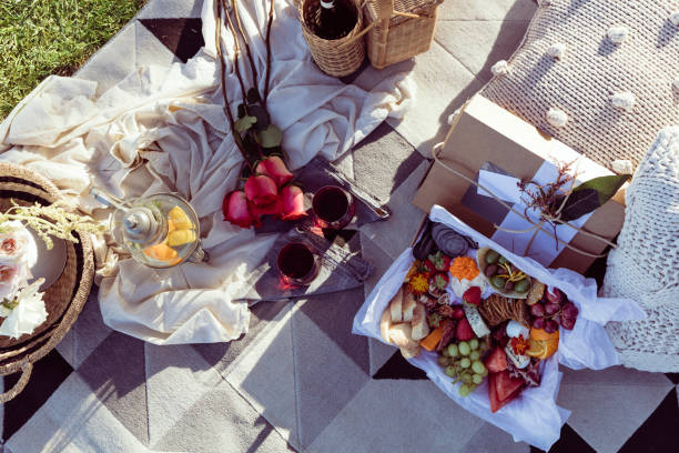 istock Romantic picnic set up with mixed food platter and win 909416668