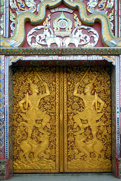 Golden door of Thai temple stock photo