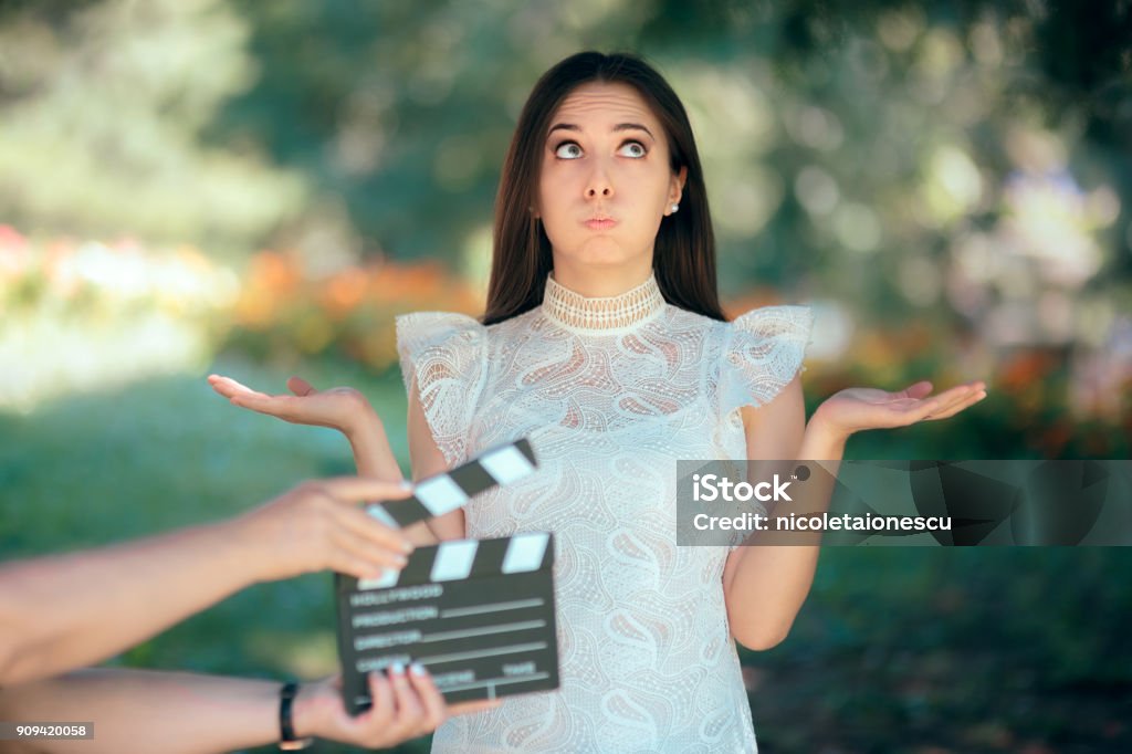 Funny Actress Auditioning for Movie Film Video Casting Woman reading her part on a microphone for a role Reality TV Stock Photo
