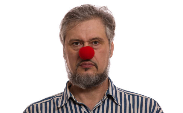 istock man with a red nose, Red Nose Day 909423564