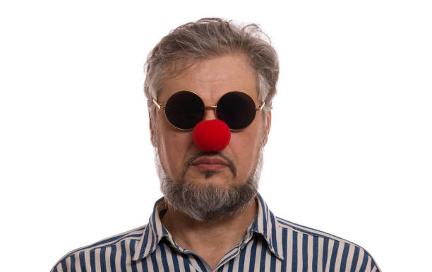 istock man with a red nose, Red Nose Day 909424292