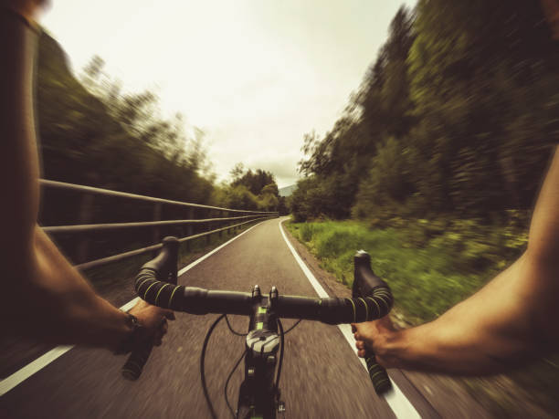 istock POV riding a road racing bicycle in the forest 909427318