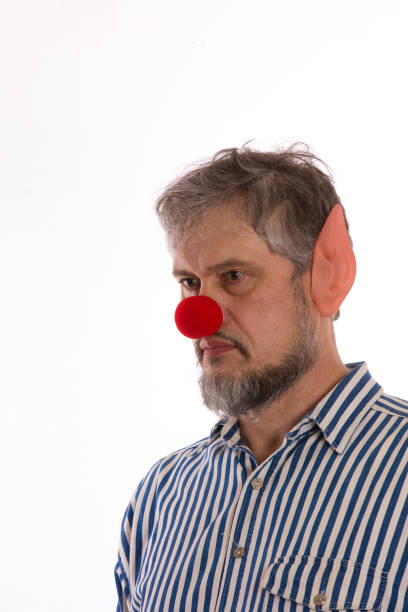 istock man with a red nose, Red Nose Day 909427868