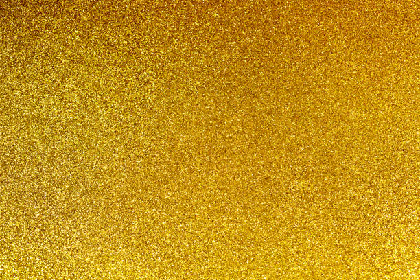 istock Abstract background filled with shiny gold glitter 909427978