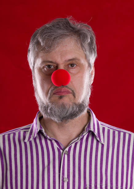 istock man with a red nose, Red Nose Day 909431080