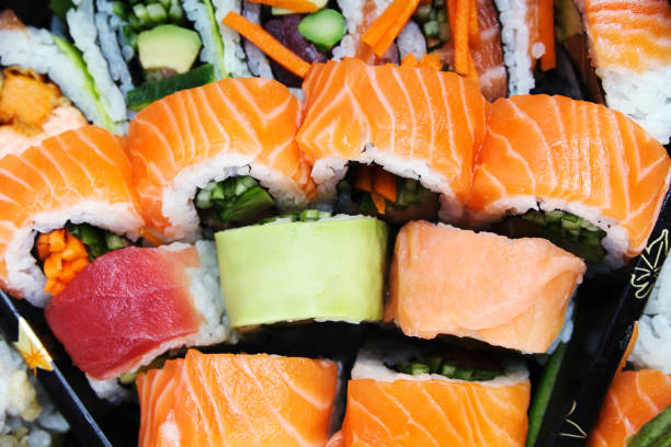 istock Sushi roll from salmon in assortment in box. 909433044