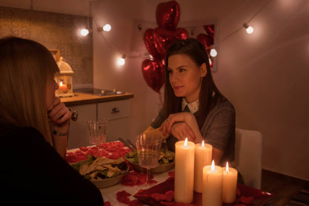 istock Lesbian couple celebrating Valentine's day 909436046