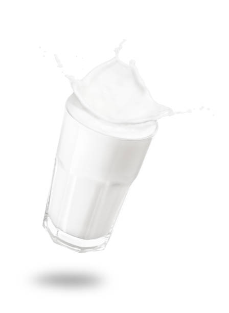 istock glass of milk with splashes 909437262
