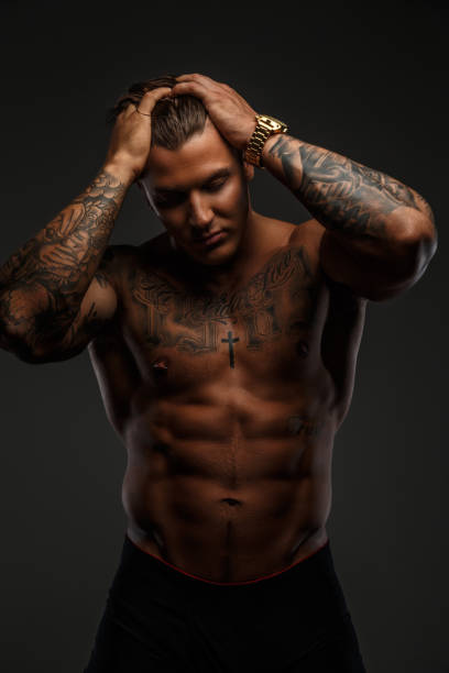 istock Strong shirtless tattooed man. 909437296