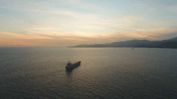 istock Water surface aerial view at sunset.Bali 909437346