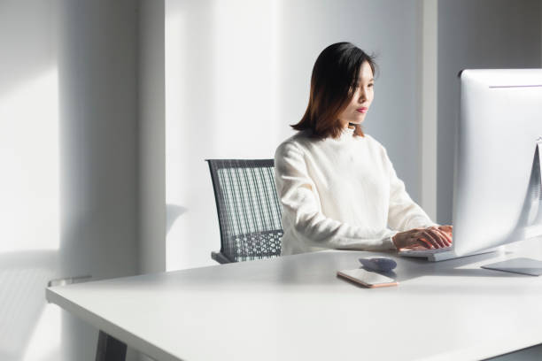 istock asian business woman working on computer 909440604