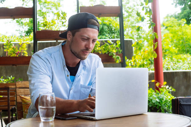 istock Young start up. Handsome business man working at laptop computer 909440744