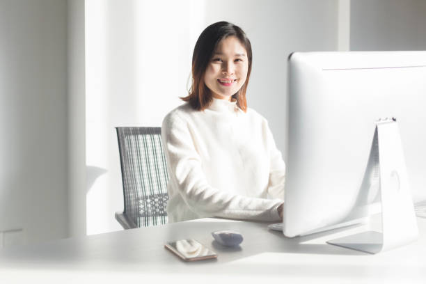 istock asian business woman working on computer 909440760