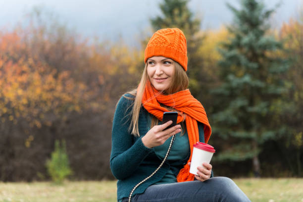 istock Woman enjoying social networking on mobile phone 909444698