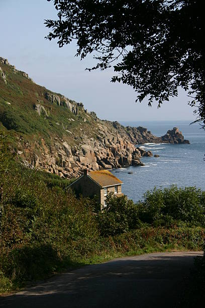 Lovely Lamorna Cove This is the one lane road down to Lamorna Cove in SW England.  It is so beautiful and almost feels like you are somewhere in the greek isles on a sunny day. lamorna cove stock pictures, royalty-free photos & images