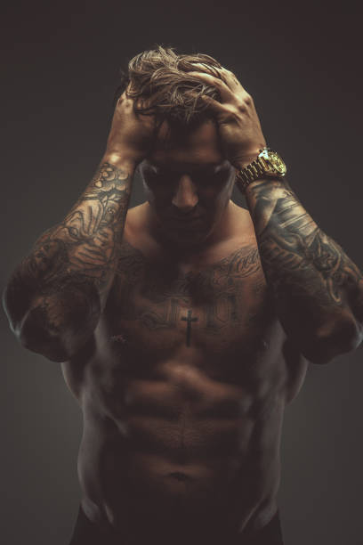 istock Strong shirtless tattooed man. 909446202