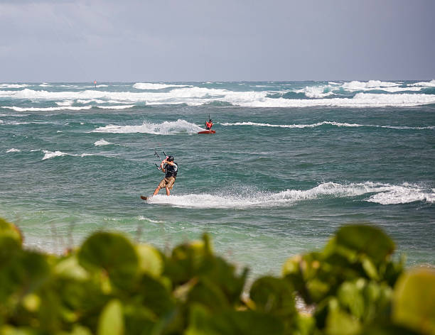 istock Kite boarders crossing paths with green foreground 90944958