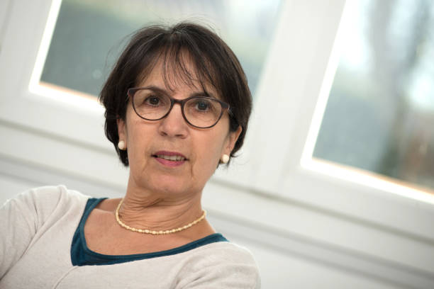 istock a portrait of middle age brunette with glasses 909452970