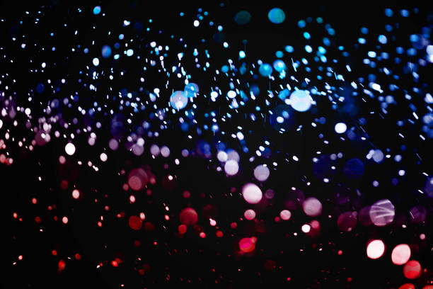 istock christmas multicolor sparkle glitter explosion dust particles background with bokeh, color holiday happy new year and valentine day love, relationship 909453730