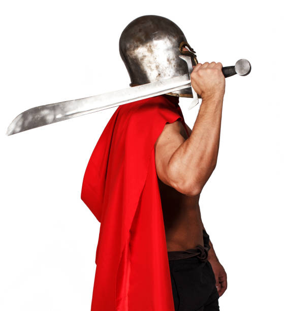 istock Sideview of shirtless warrior who is holding his sword 909454122