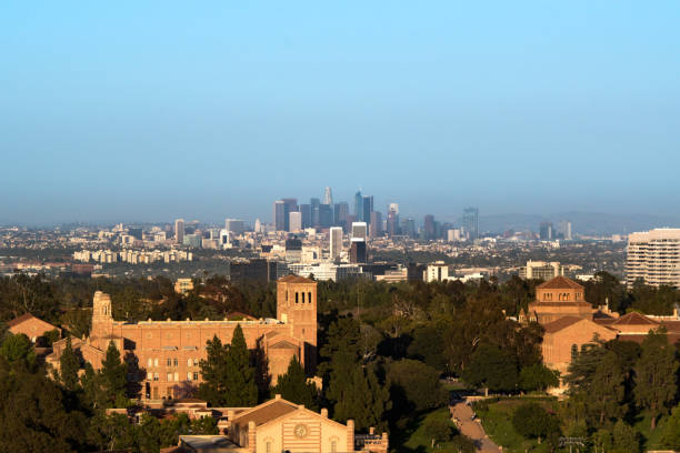 UCLA with Los Angeles Sunset picture of the University of California, Los Angeles (UCLA) with the skyscrapers of downtown Los Angeles in the background. ucla photos stock pictures, royalty-free photos & images