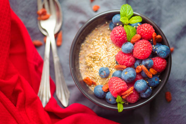 Healthy Eating – gluten free, organic porridge with quinoa, wolfberries, blue berries, raspberries and popped amaranth