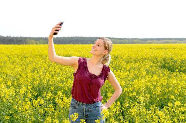 istock woman taking selfie 909460514