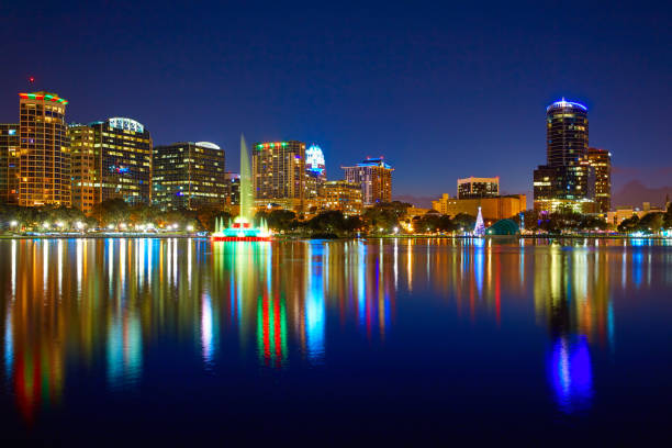 istock Orlando skyline sunset at lake Eola Florida US 909460550