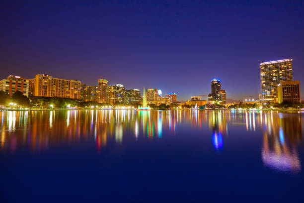 istock Orlando skyline sunset at lake Eola Florida US 909460602