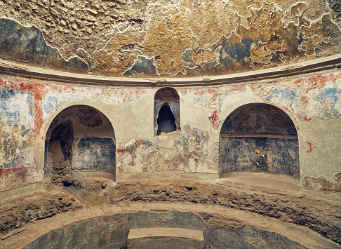 Interior of one of the bathrooms in Stabian Baths Pompeii, Italy with partially preserved frescoes