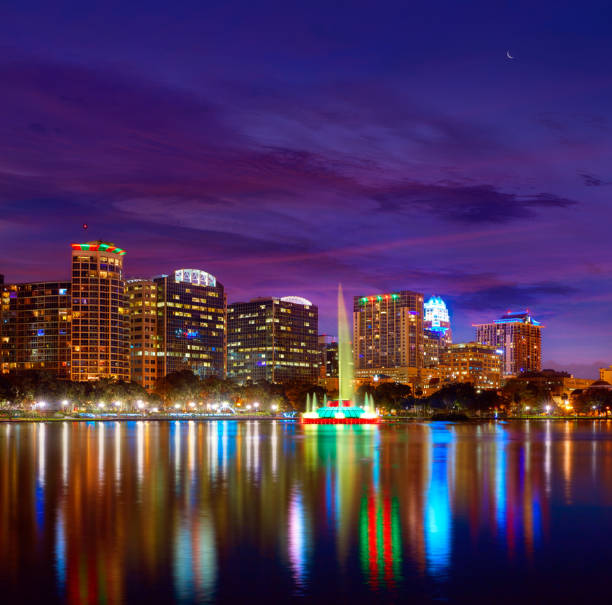 istock Orlando skyline sunset at lake Eola Florida US 909460730