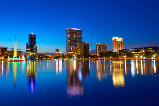 istock Orlando skyline sunset at lake Eola Florida US 909460778