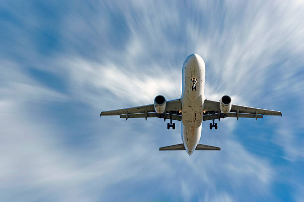 istock XXL jet airplane landing in motion blur sky 90946082