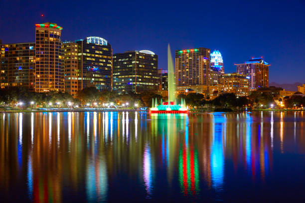 istock Orlando skyline sunset at lake Eola Florida US 909460914
