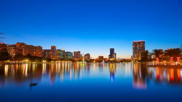 istock Orlando skyline sunset at lake Eola Florida US 909460960
