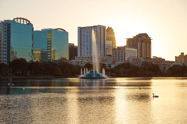 istock Orlando skyline sunset at lake Eola Florida US 909461218