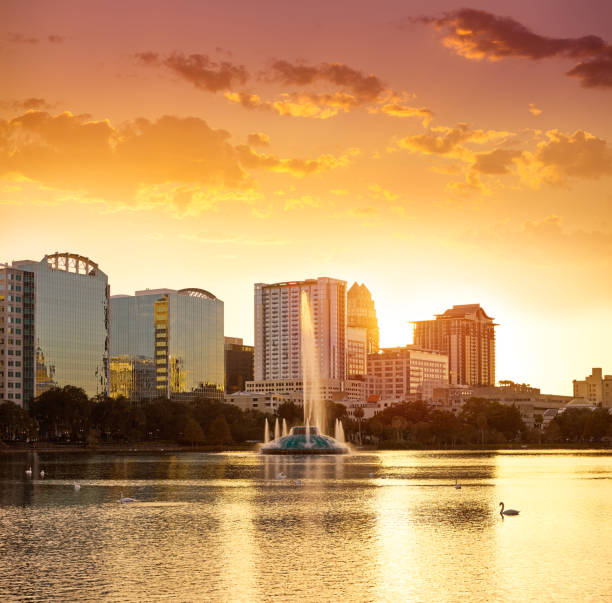 istock Orlando skyline sunset at lake Eola Florida US 909461264