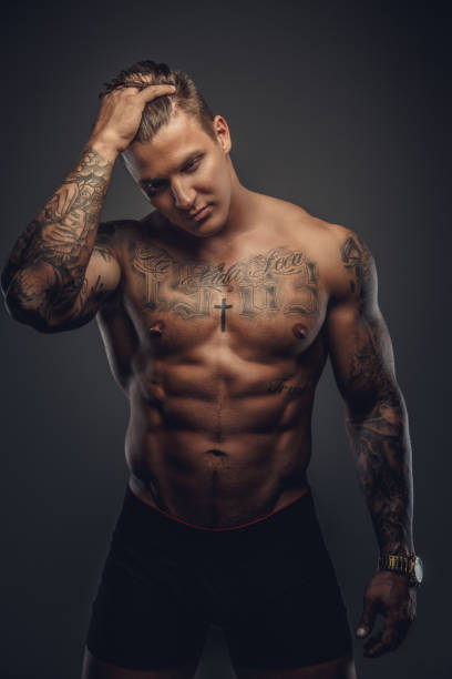 istock Strong shirtless tattooed man. 909461484