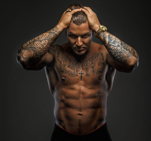 istock Strong shirtless tattooed man. 909462268